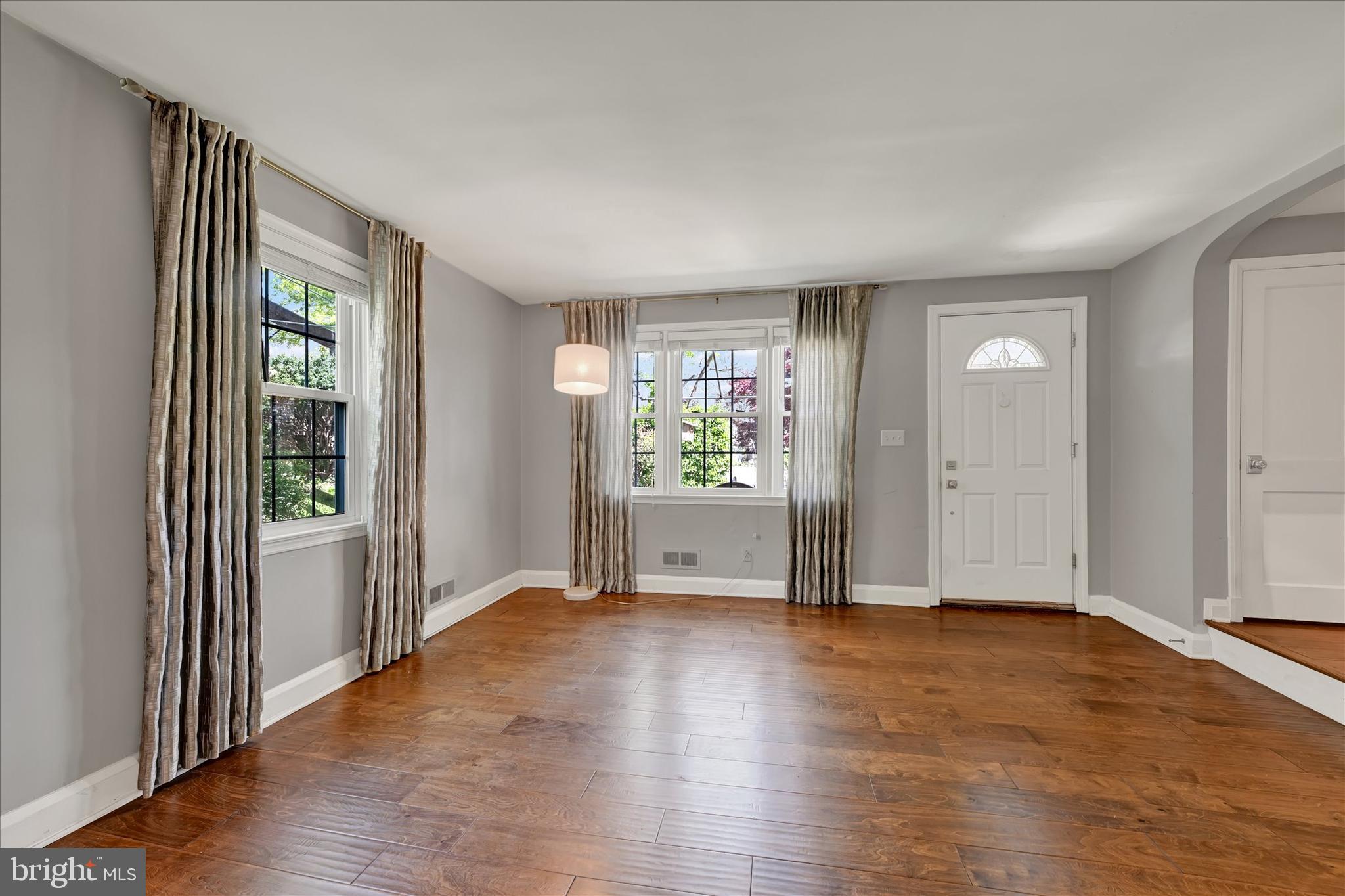 7220 Lanark Road Baltimore, MD 21212 - Photo 5 of 28 an empty room with wooden floor and windows