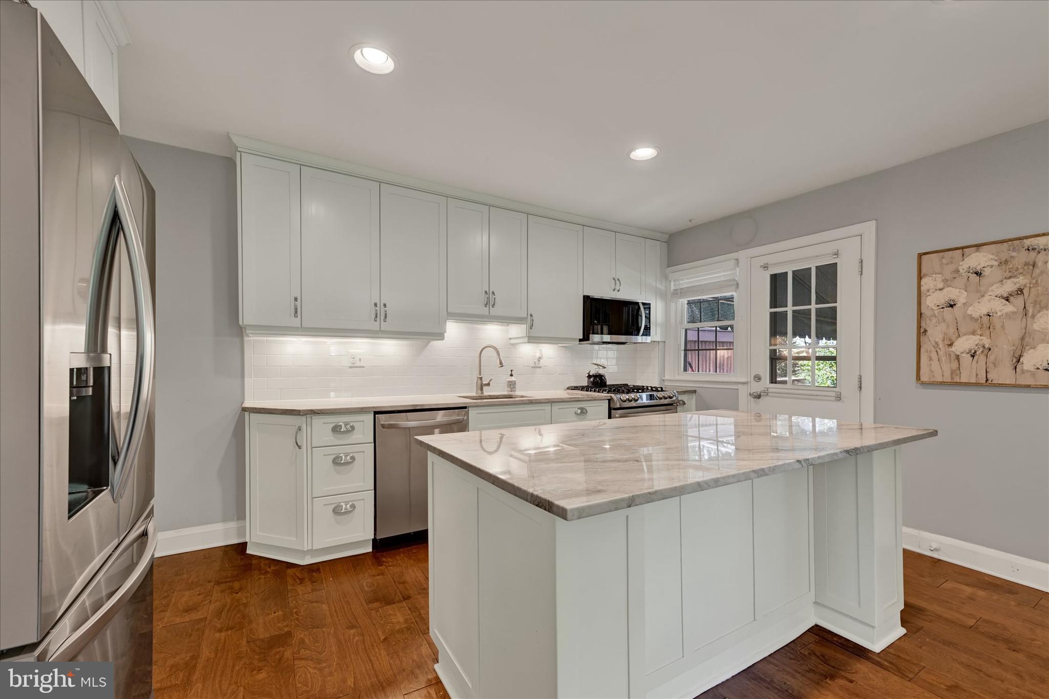7220 Lanark Road Baltimore, MD 21212 - Photo 9 of 28 a kitchen with stainless steel appliances granite countertop a sink stove and refrigerator