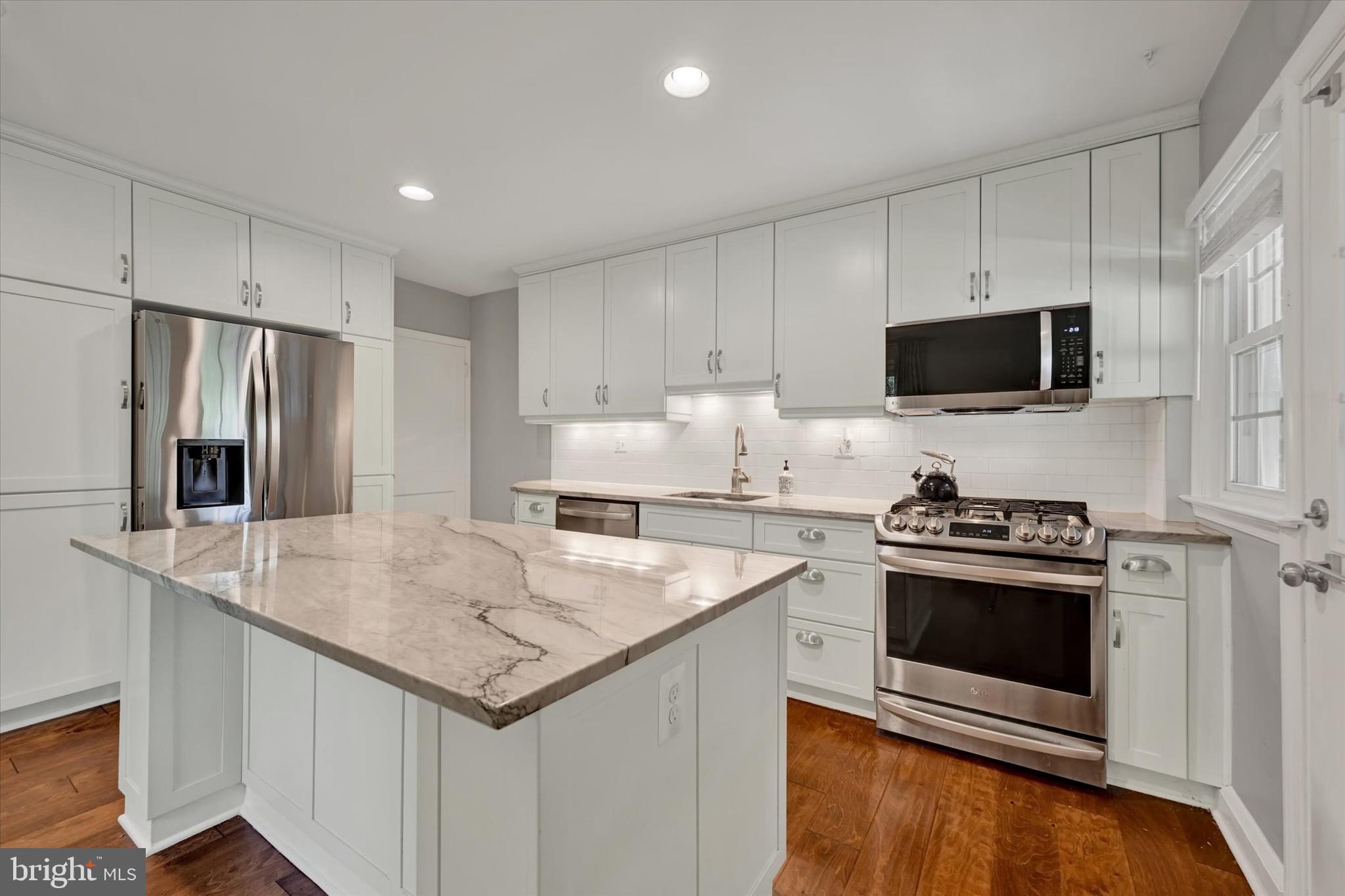 7220 Lanark Road Baltimore, MD 21212 - Photo 10 of 28 a kitchen with granite countertop a stove and a sink