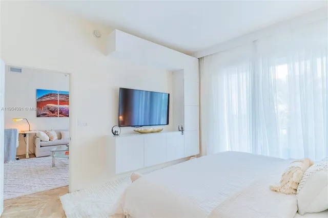 a bedroom with a bed and furniture