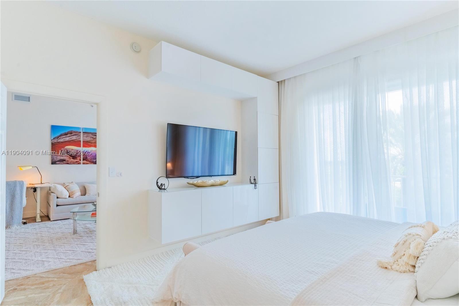 802 West Windward Way, Unit 411 Lantana, FL 33462 - Photo 15 of 42 a bedroom with a bed and furniture