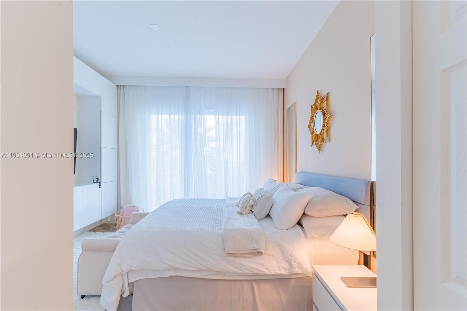 802 West Windward Way, Unit 411 Lantana, FL 33462 - Photo 17 of 42 a bedroom with a bed and painting on the wall