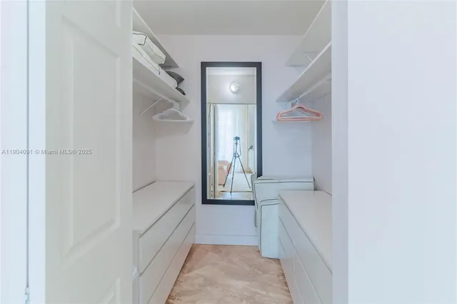 a bathroom with a tub and shower