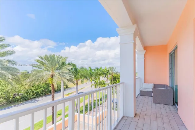 a view of a balcony with wooden floor