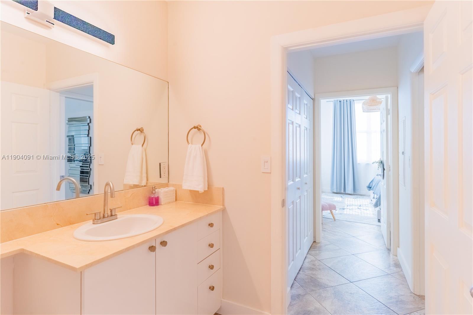 802 West Windward Way, Unit 411 Lantana, FL 33462 - Photo 29 of 42 a bathroom with a sink and a mirror