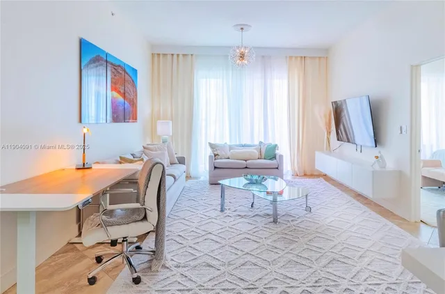 a dining room with furniture and a window