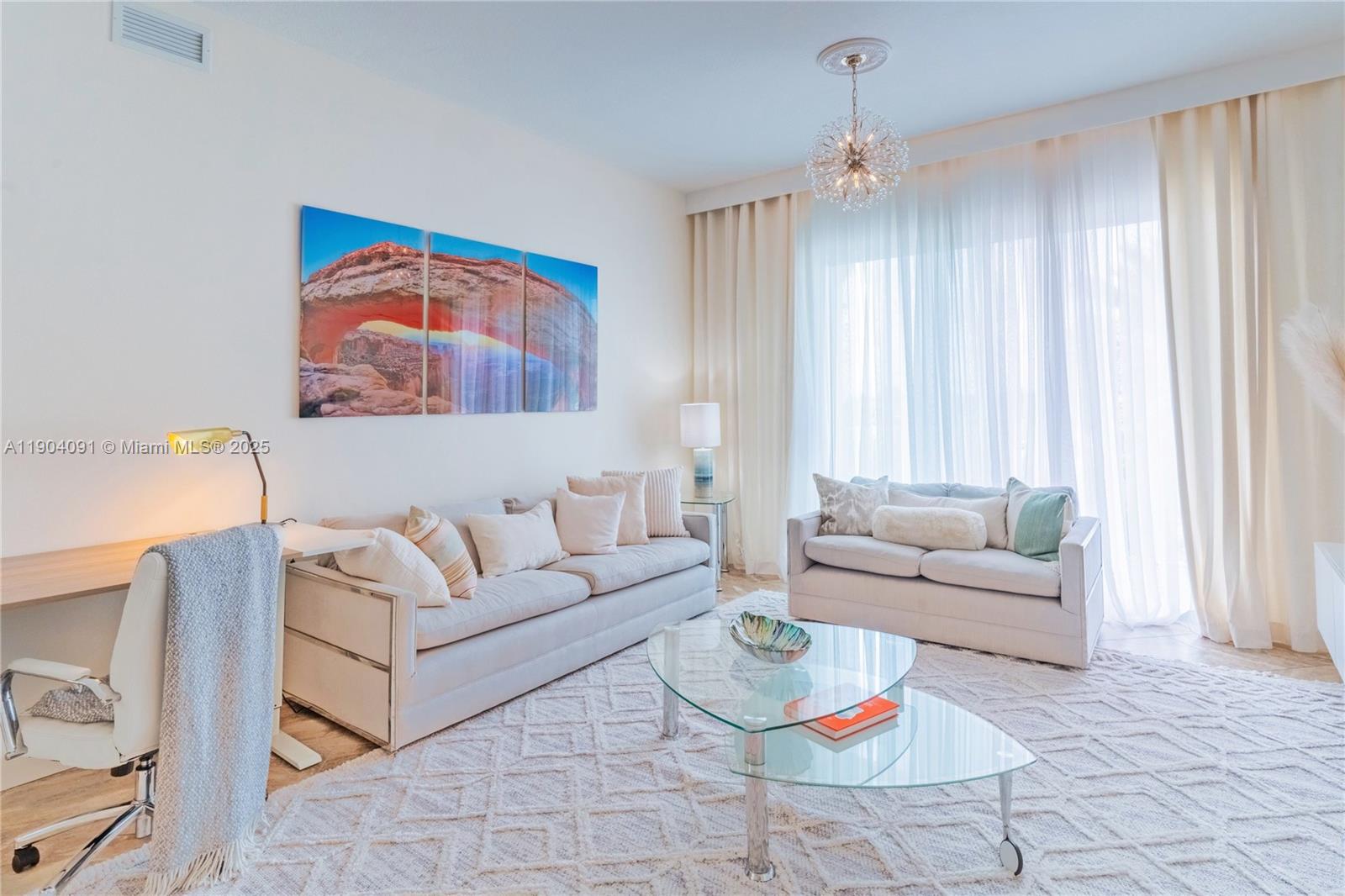 802 West Windward Way, Unit 411 Lantana, FL 33462 - Photo 4 of 42 a living room with furniture and a window