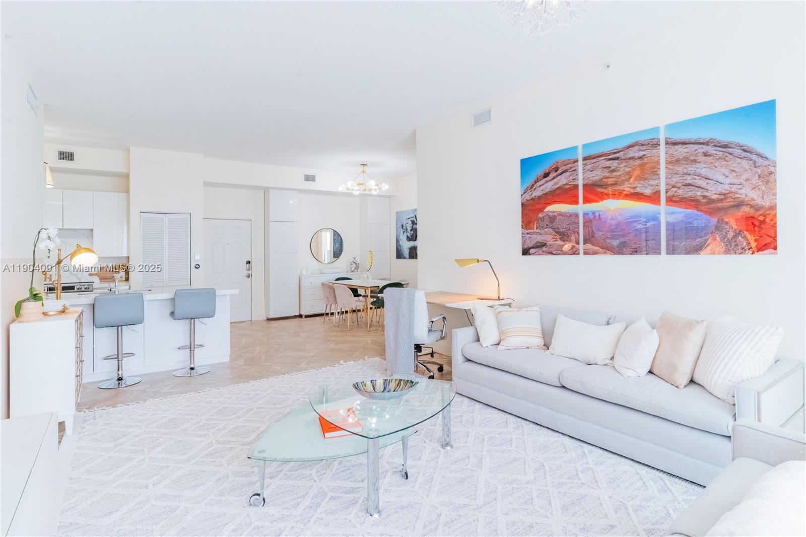 802 West Windward Way, Unit 411 Lantana, FL 33462 - Photo 6 of 42 a living room with furniture and a floor to ceiling window