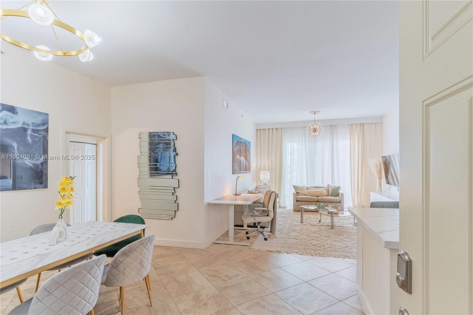 802 West Windward Way, Unit 411 Lantana, FL 33462 - Photo 7 of 42 a living room with furniture and a dining table with chairs