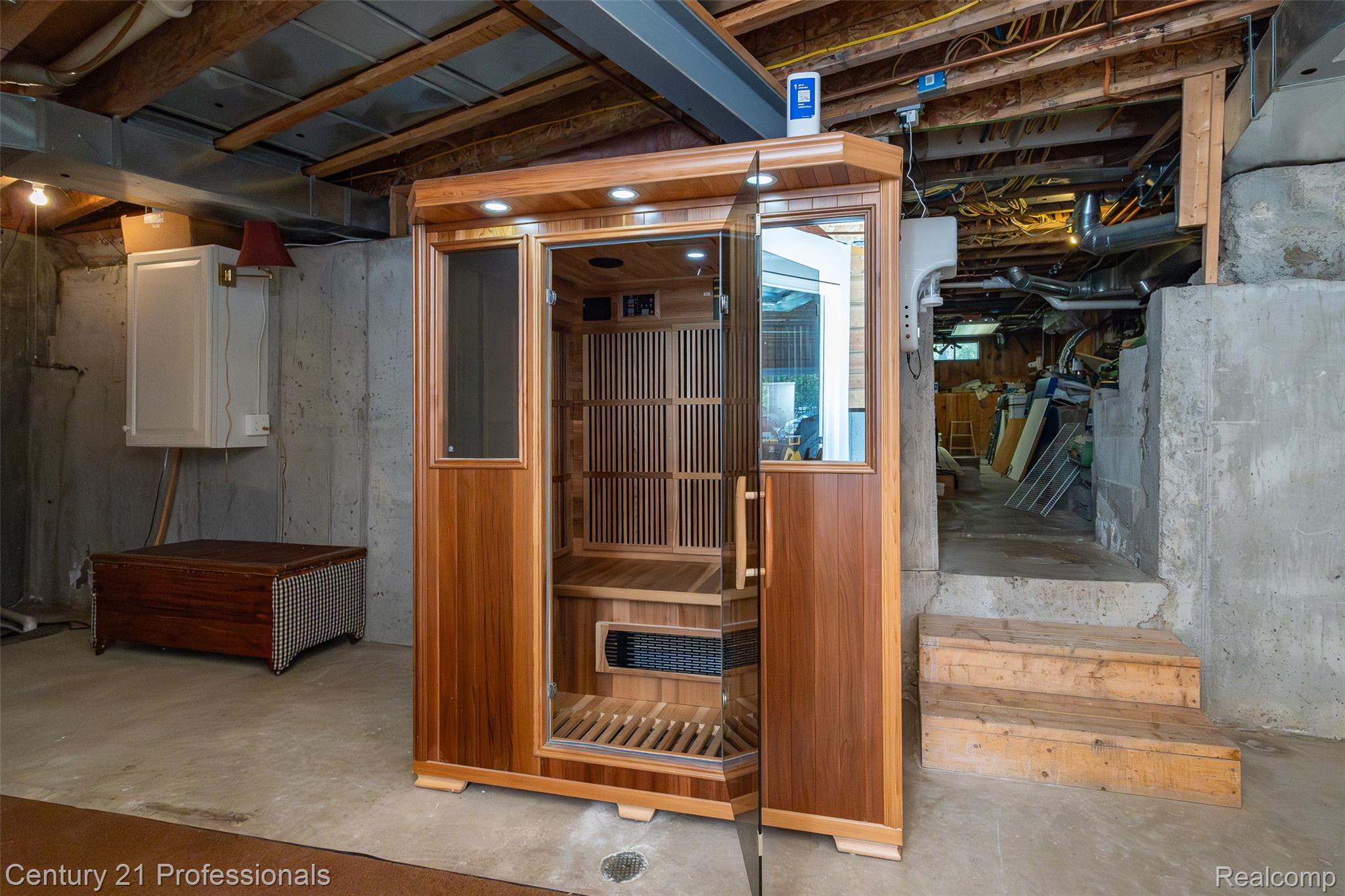 3251 Mann Road Clarkston, MI 48346 - Photo 33 of 40 Wood-paneled sauna featuring a glass door, interior seating, and integrated lighting
