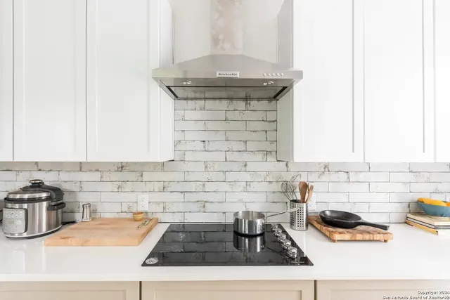 a kitchen with a sink and cabinets