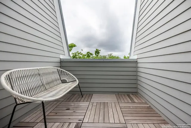 a view of balcony with furniture