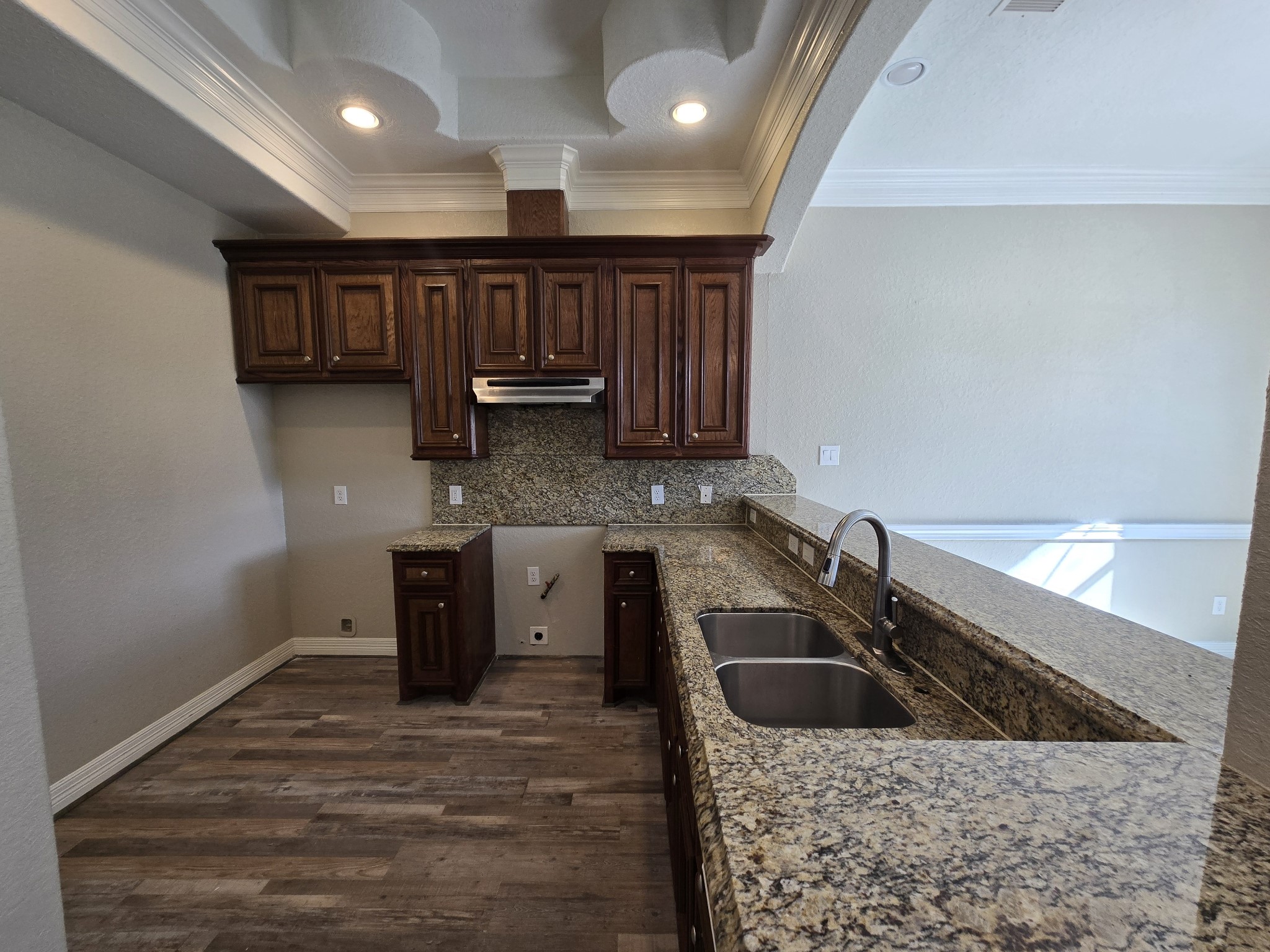 6324 Anderson Road, Unit A Houston, TX 77085 - Photo 11 of 18 a kitchen with stainless steel appliances granite countertop a sink a stove and a wooden cabinets