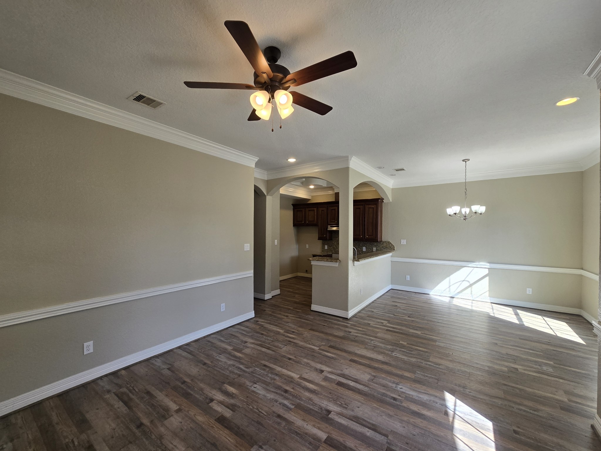 6324 Anderson Road, Unit A Houston, TX 77085 - Photo 13 of 18 a view of a room with wooden floor and a ceiling fan