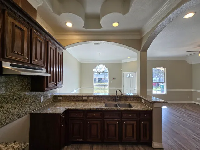 a bathroom with a sink and a large mirror