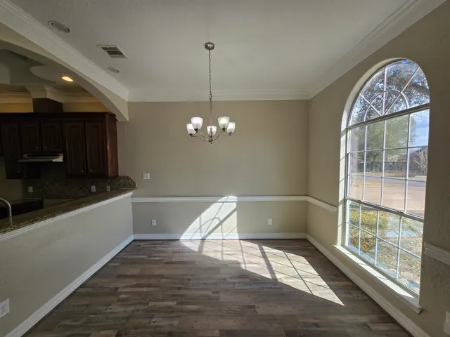 a view of entryway with kitchen