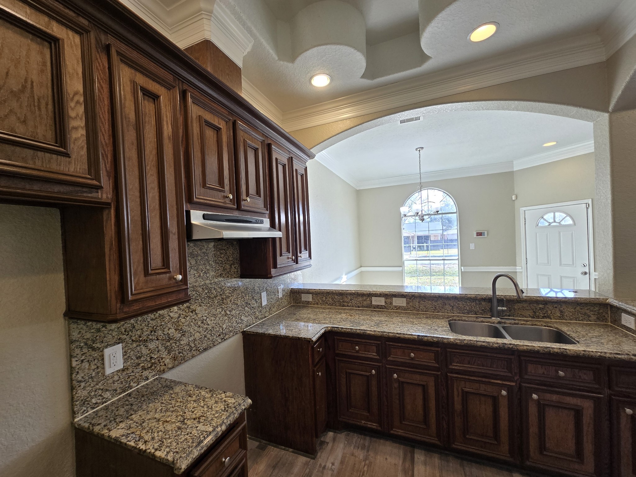 6324 Anderson Road, Unit A Houston, TX 77085 - Photo 17 of 18 a kitchen with granite countertop a sink and a stove