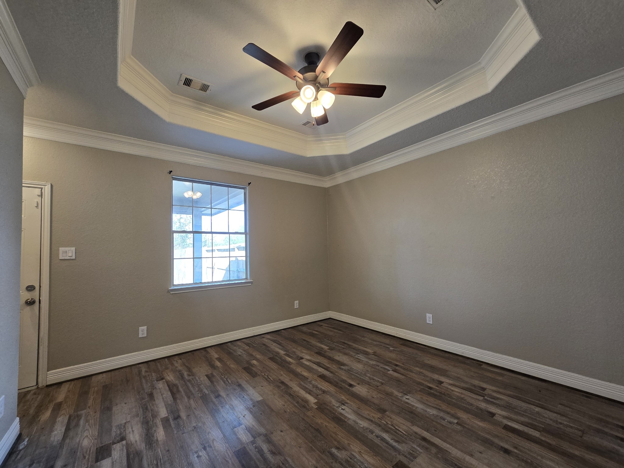 6324 Anderson Road, Unit A Houston, TX 77085 - Photo 2 of 18 a view of an empty room with wooden floor and a ceiling fan