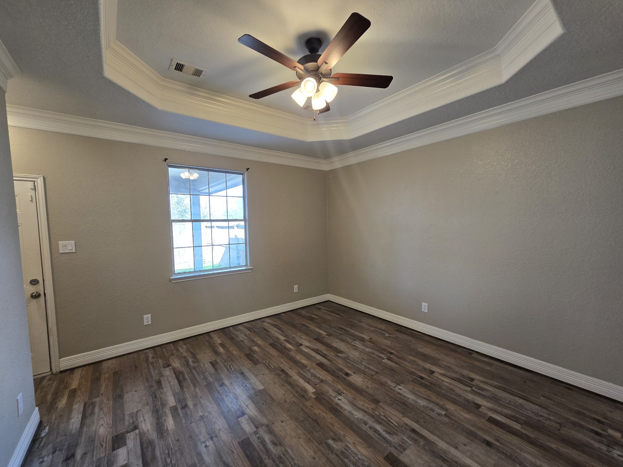 6324 Anderson Road, Unit A Houston, TX 77085 - Photo 3 of 18 wooden floor in an empty room with a window