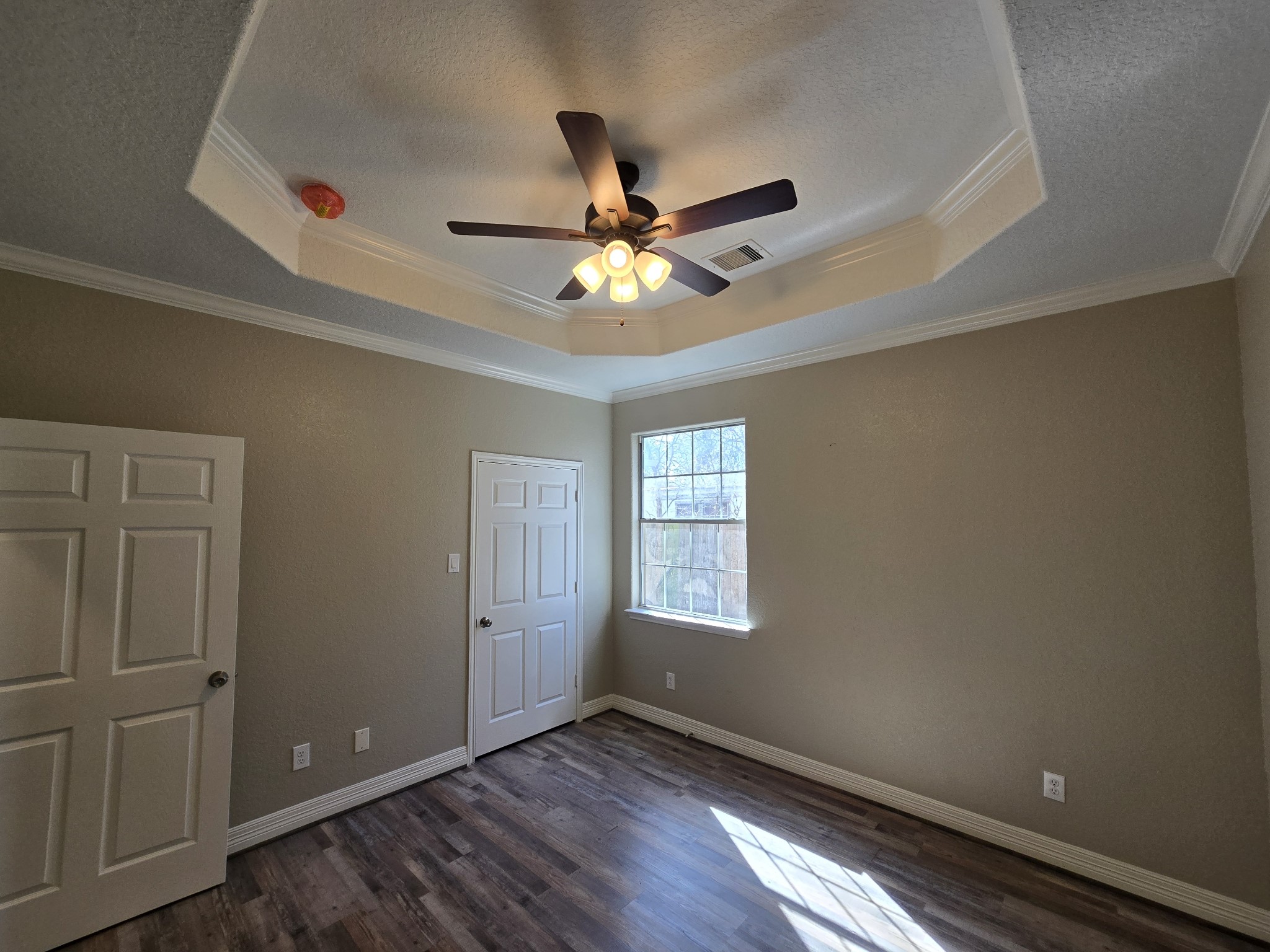 6324 Anderson Road, Unit A Houston, TX 77085 - Photo 6 of 18 wooden floor in an empty room with a window