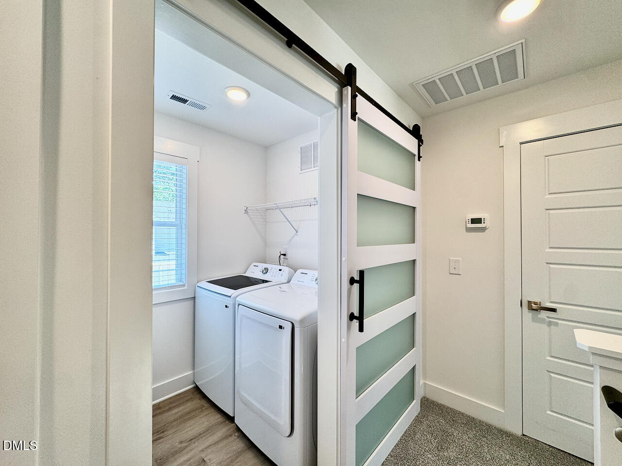 218 George Street, Unit A Four Oaks, NC 27524 - Photo 15 of 28 Upstairs Laundry with Glass Barn Door