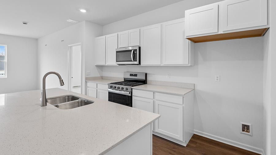 17523 West Windemere Circle Lockport, IL 60441 - Photo 3 of 29 a kitchen with granite countertop white cabinets and stainless steel appliances
