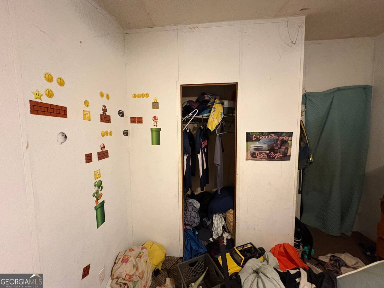 798 Williamson Road Tallapoosa, GA 30176 - Photo 21 of 73 a view of walk in closet with clothes and shoes