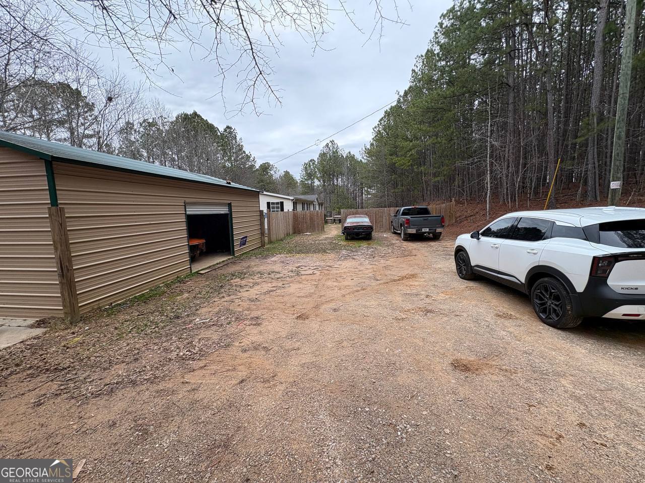 798 Williamson Road Tallapoosa, GA 30176 - Photo 55 of 73 a view of a car parked in back yard of a house