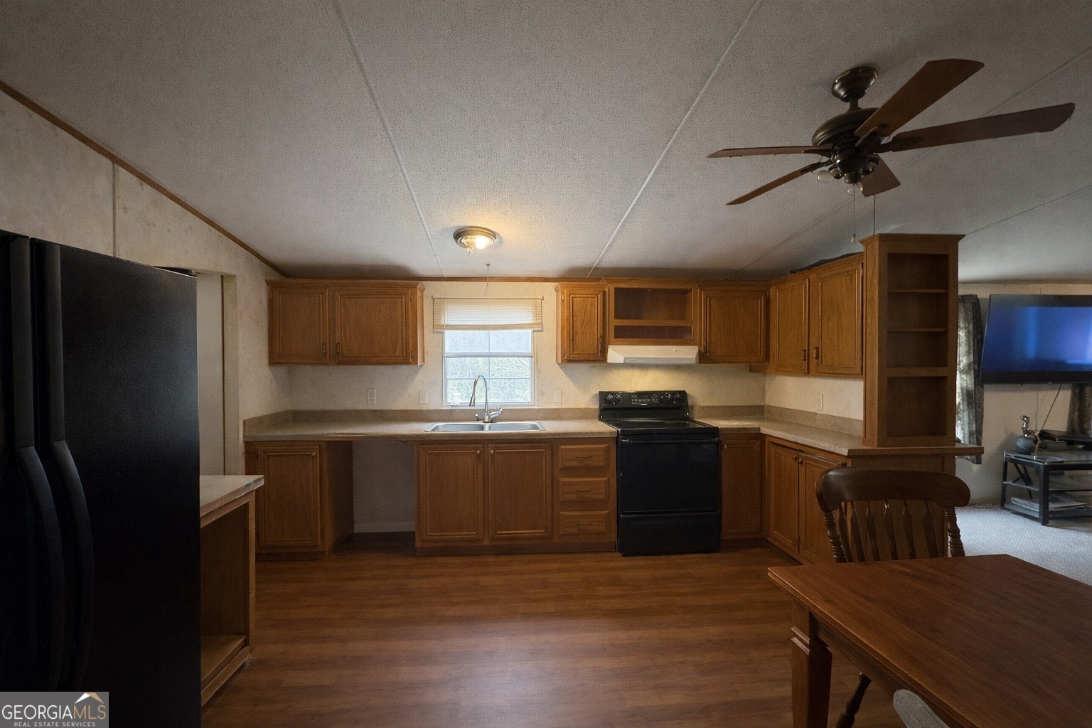 798 Williamson Road Tallapoosa, GA 30176 - Photo 58 of 73 a kitchen with a refrigerator and a stove top oven