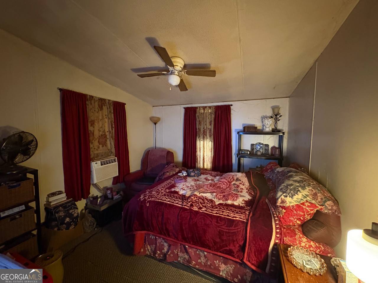 798 Williamson Road Tallapoosa, GA 30176 - Photo 65 of 73 a bedroom with a bed and a chandelier