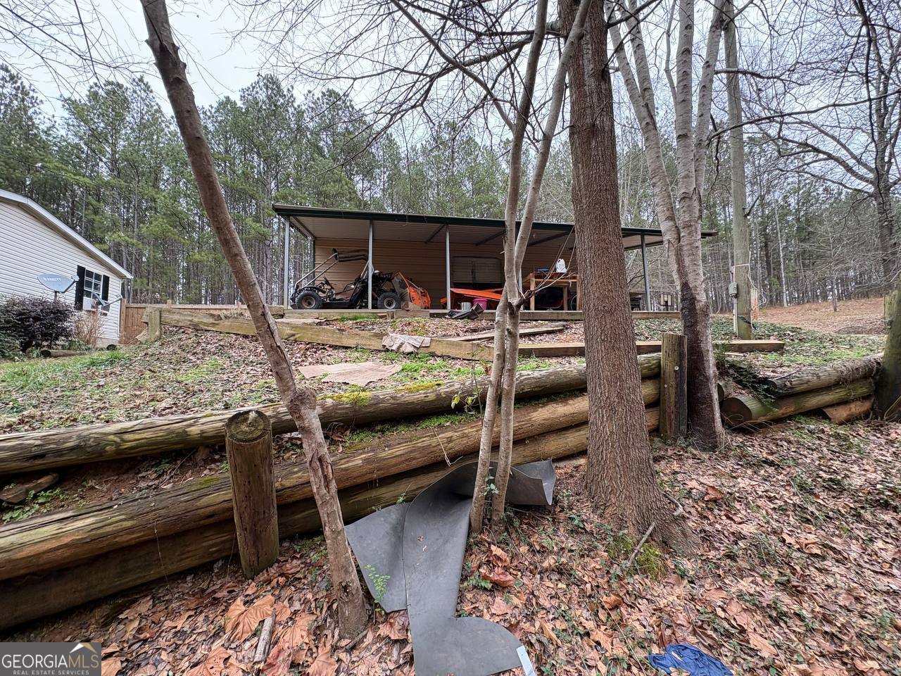 798 Williamson Road Tallapoosa, GA 30176 - Photo 8 of 73 a view of house with backyard and seating area