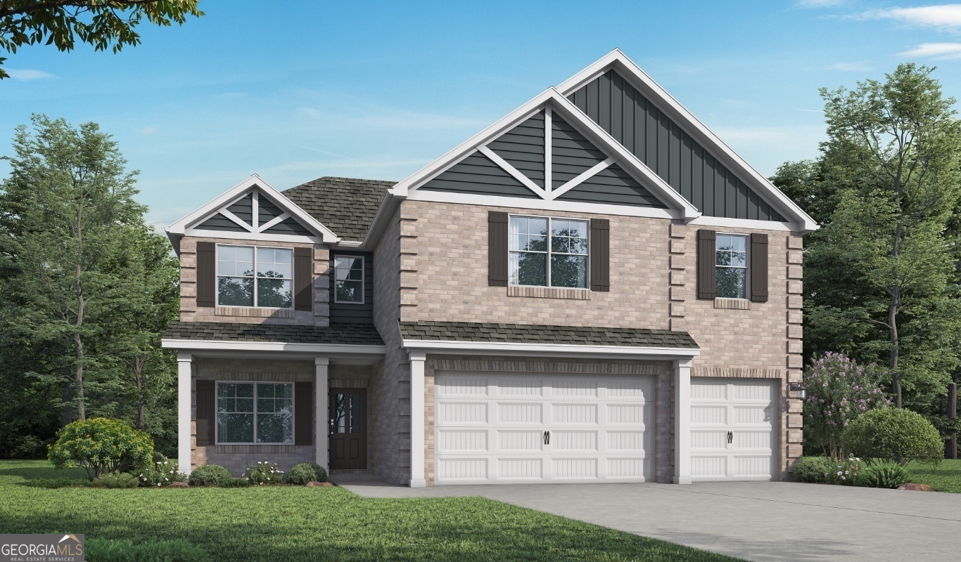 1237 Trombone Way, Unit 11 McDonough, GA 30252 - Photo 1 of 23 a front view of a house with a yard and garage