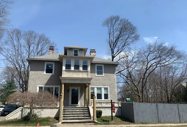 a front view of a house with a porch