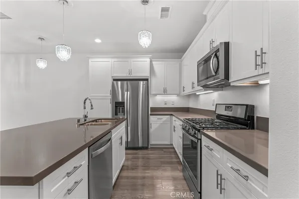 a view of kitchen with wooden floor