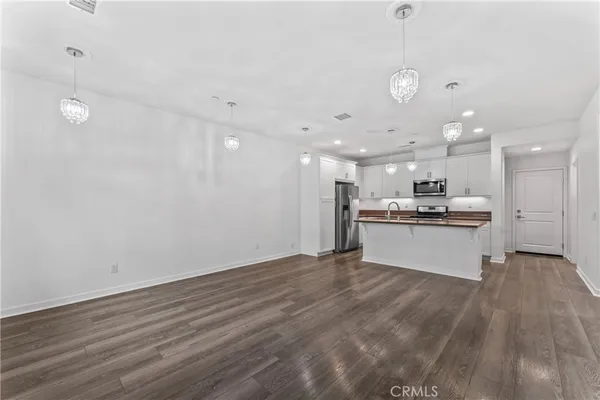 an empty room with a chandelier