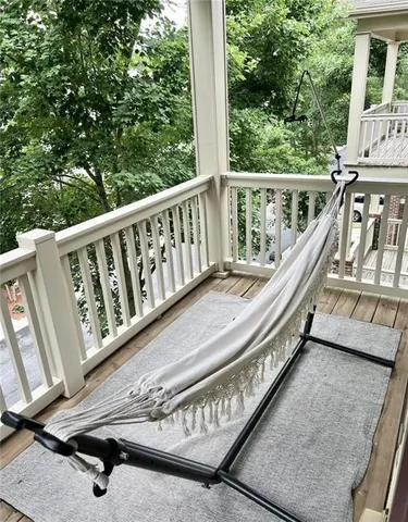 a view of a balcony with chairs