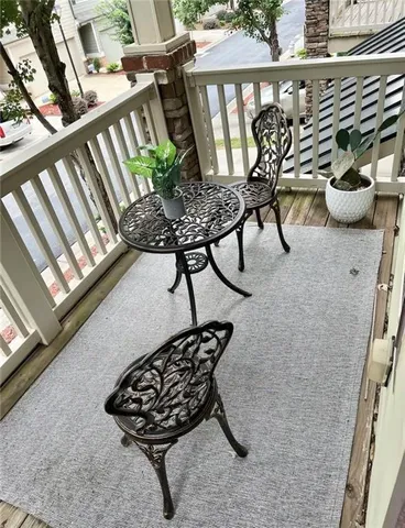 a table with chairs in front of a window