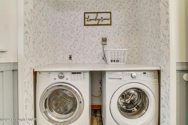 a utility room with dryer and washer