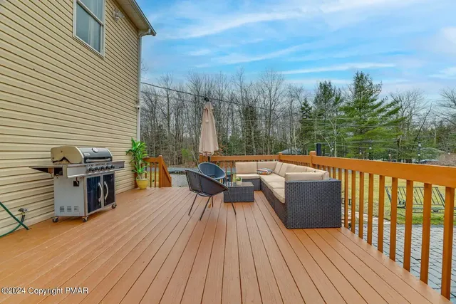 a view of a roof deck with couches