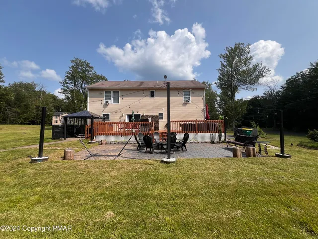 a view of a lake with outdoor seating
