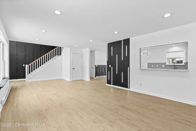 a view of a roof deck with furniture