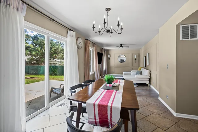 a view of a dining room with furniture window and outside view
