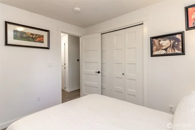 a bedroom with a bed and a view of bathroom