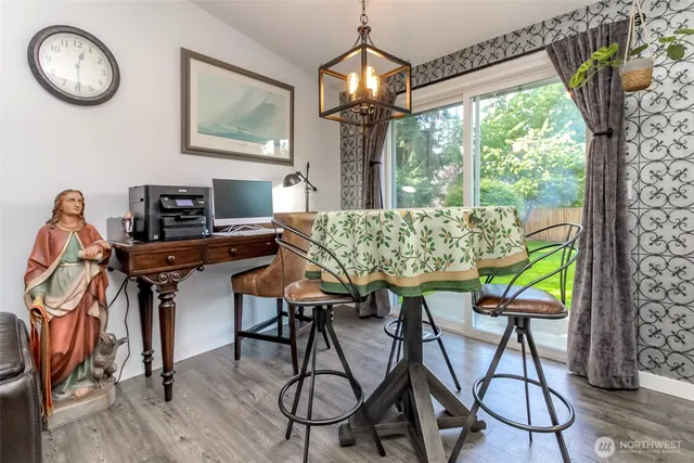 a view of a dining room with furniture window and wooden floor