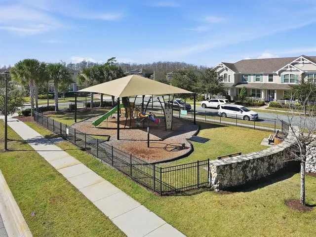 a view of a swimming pool with lounge chairs