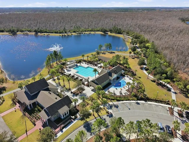 an aerial view of a house with a lake view