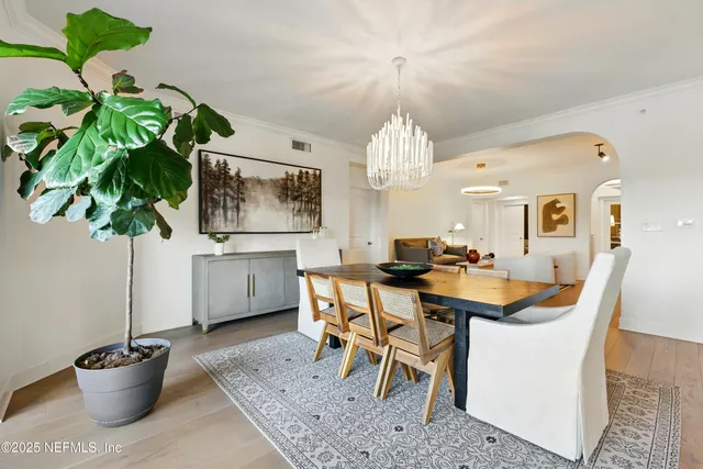 a kitchen with stainless steel appliances a refrigerator sink and cabinets