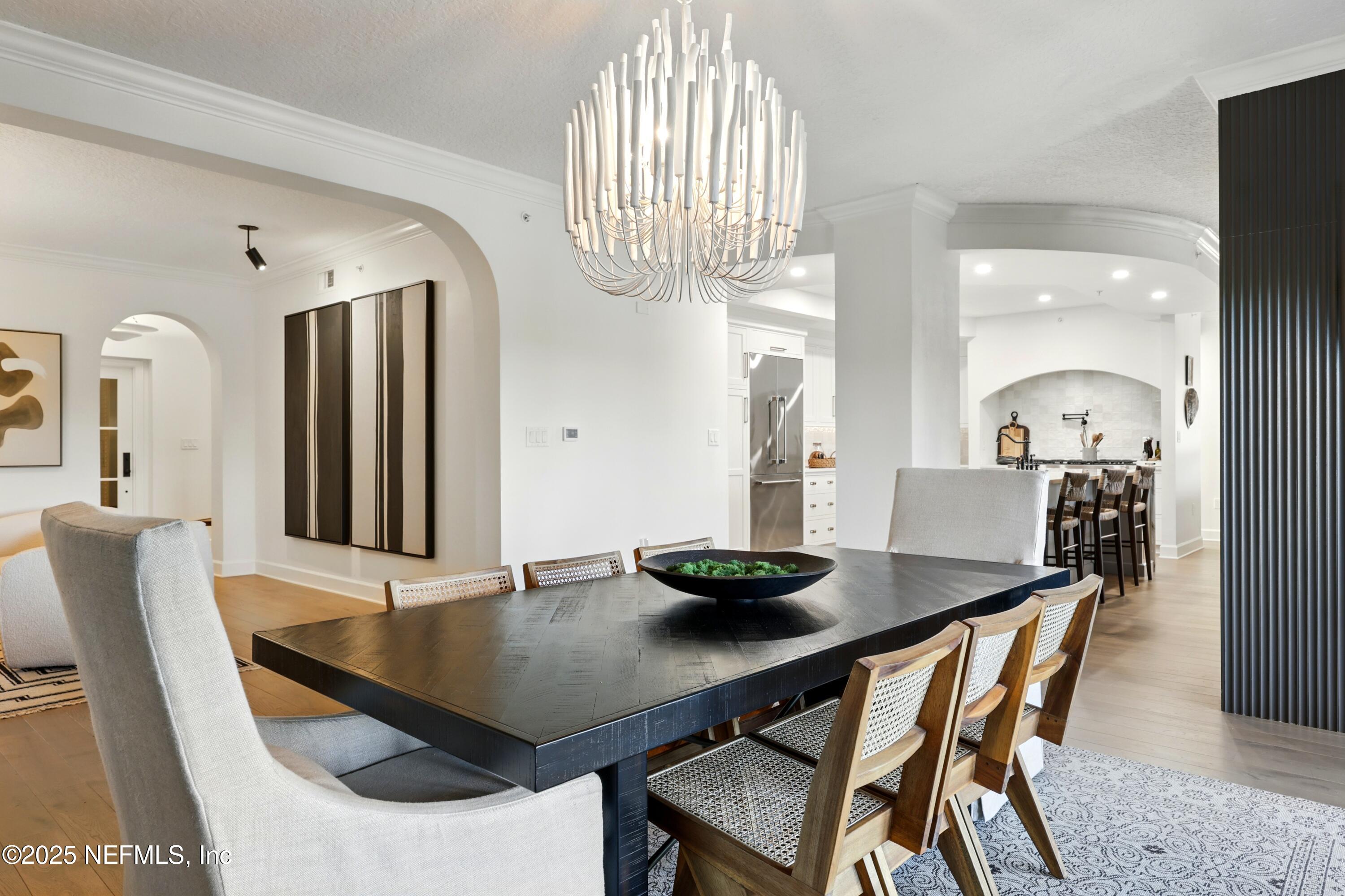 3958 Baymeadows Road, Unit 1602 Jacksonville, FL 32217 - Photo 13 of 89 a view of a dining room with furniture and wooden floor