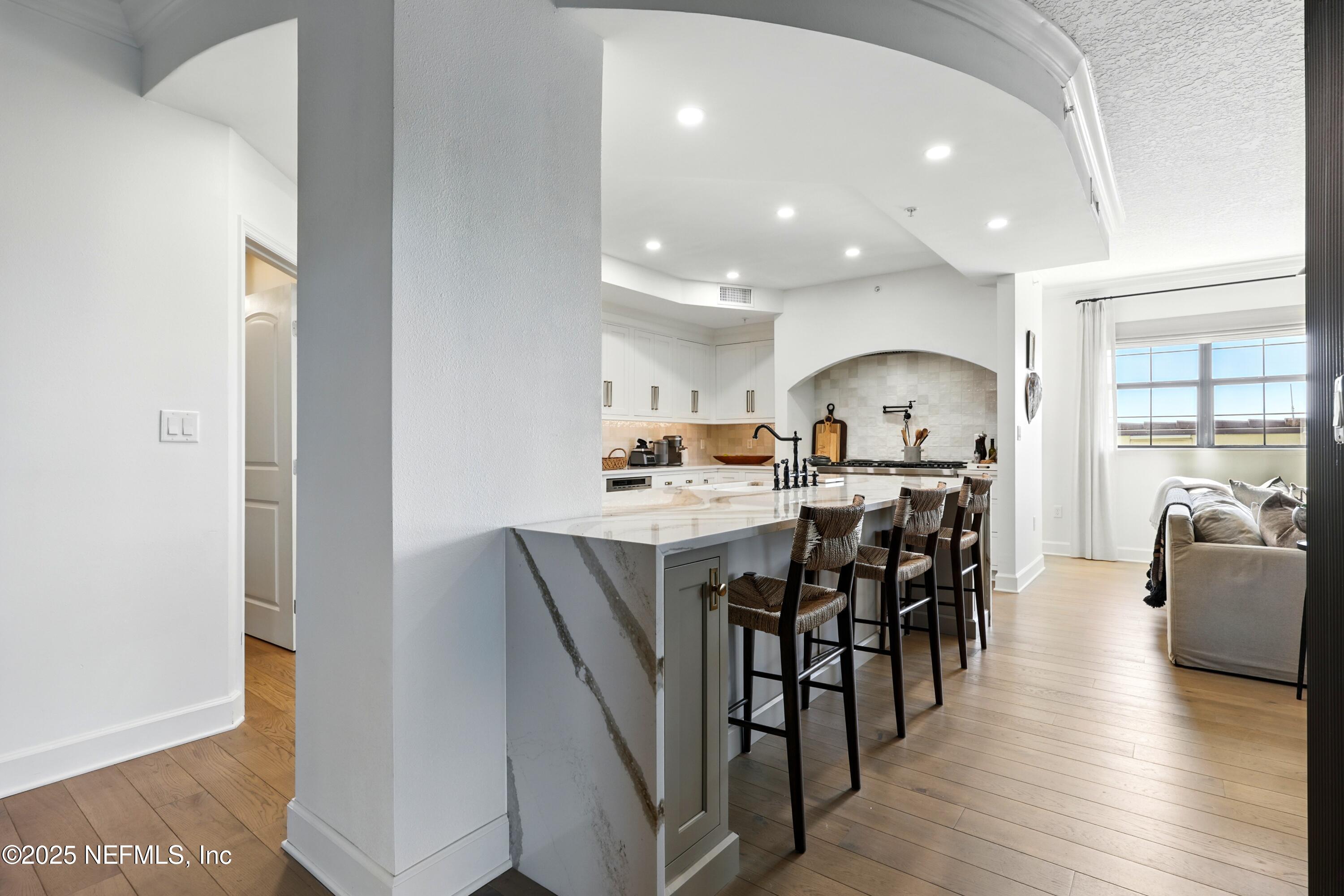 3958 Baymeadows Road, Unit 1602 Jacksonville, FL 32217 - Photo 17 of 89 a view of a dining room with furniture and wooden floor