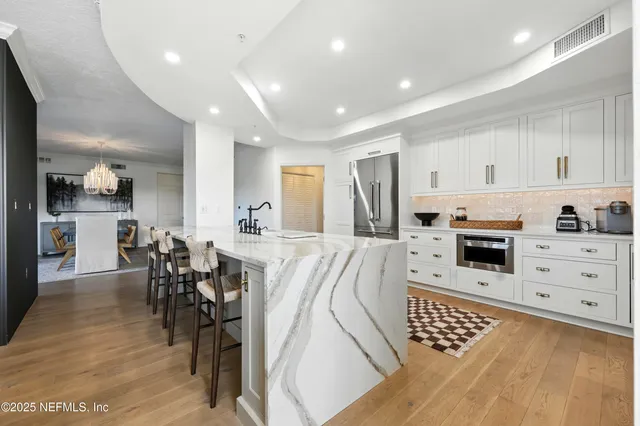 a white bath tub sitting in a bathroom